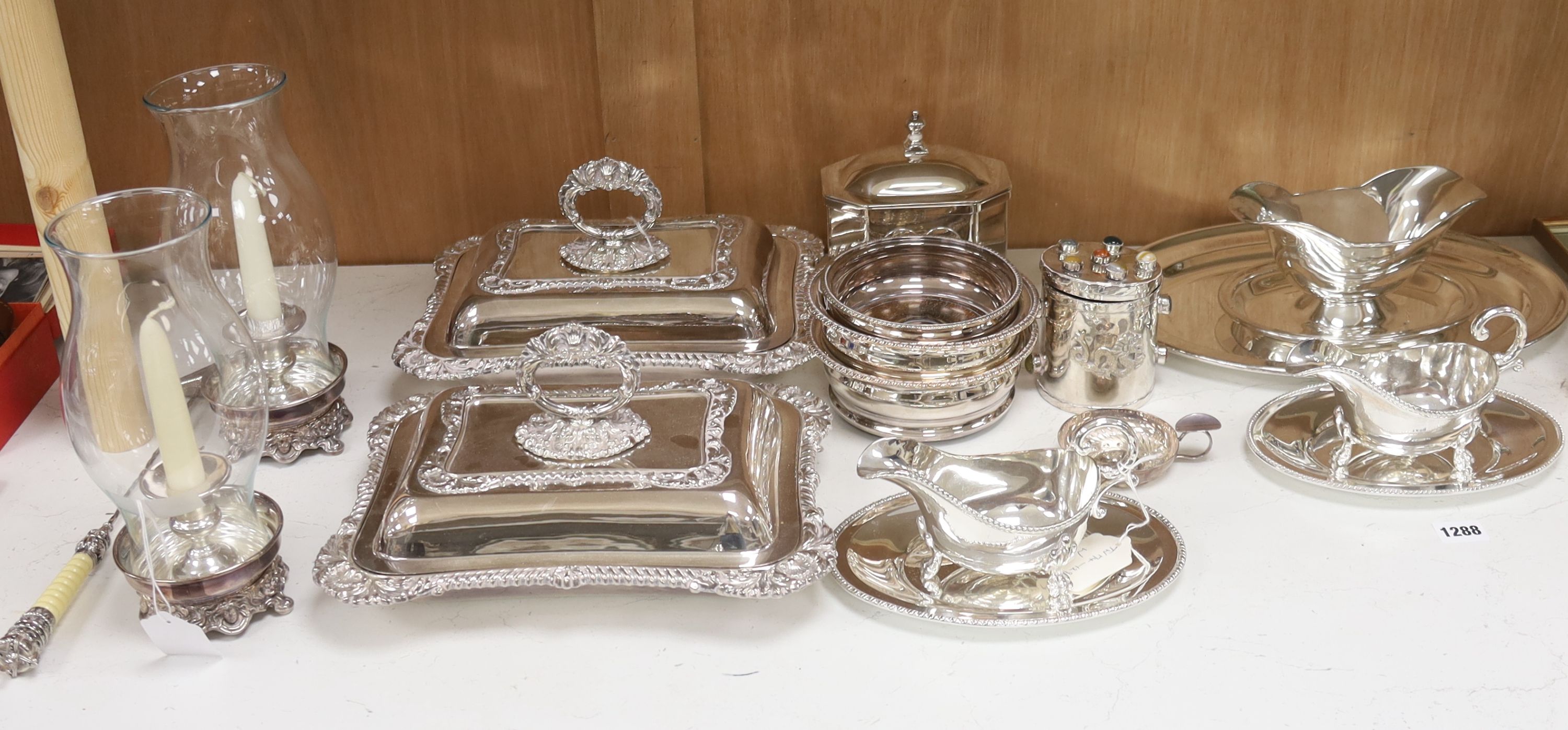 Various plated items, including a pair of rectangular entrée dishes and cover